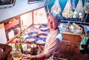 woman cooking on boat