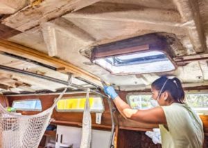 woman cleaning boat interior