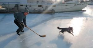 man and dog on ice