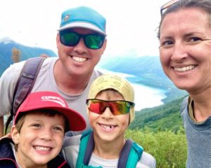family smiling at camera