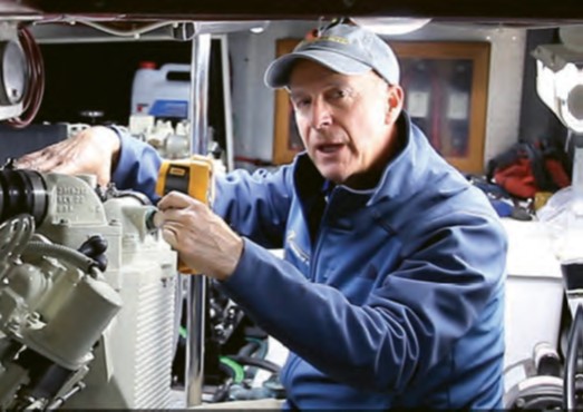 man in boat engine room