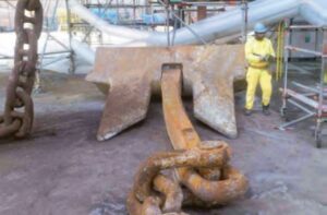 large anchor next to person