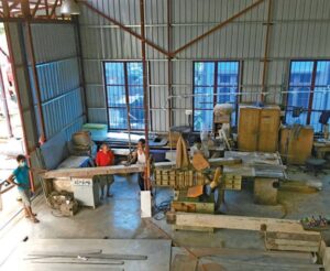 workers reclaiming teak