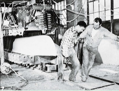 men working on boat hull