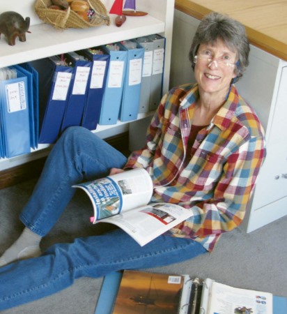 woman sitting on floor with magazine