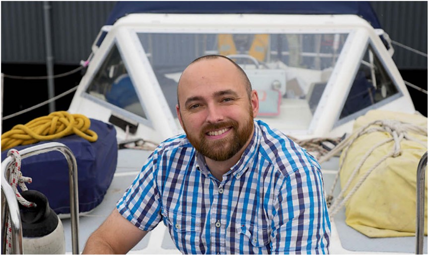 man sitting on a boat