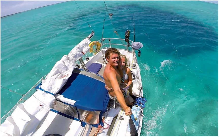 man and woman on a boat at sea