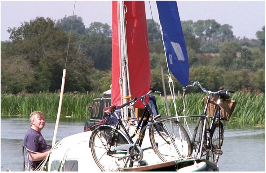 man on a boat with bikes