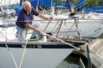 man cleaning an anchor