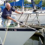 man cleaning an anchor