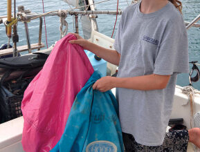 Image of putting a beanbag in a sailbag