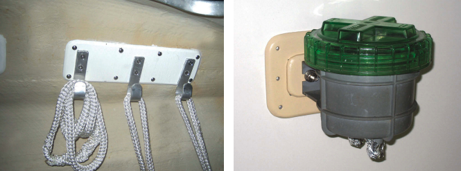 The only place Drew could conveniently mount hooks in Shoal Survivor’s sail locker was on the inside of the hull, at left. Not wanting to use through-bolts, he used a glued-on surface mount. Drew has a silica gel filter on the vent to his gasoline tank. He couldn’t reach the back side of the bulkhead to use through-bolts so he mounted the filter to an FRP plate and bonded the plate to the bulkhead, at right.