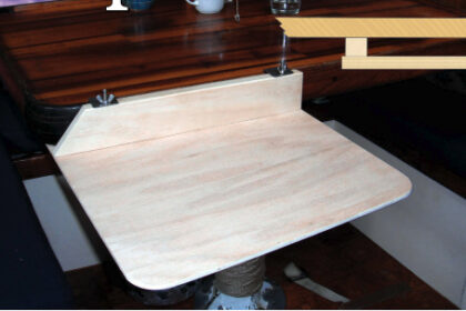 The dinette table didn’t meet Connie’s needs as a desk for a liveaboard writer, so Dave, her handy husband, fashioned a small extension that can be quickly attached or removed.