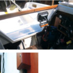 The piece of clear Plexiglas that Henk used for the hatchboard was short by two inches, at top, but that proved to be a good thing as the gap allows for ventilation but, most of the time, does not admit rain. For those occasions when the wind and rain are from aft, a teak strip closes the gap, above. After expanding the storage space a little, Henk is able to stow the Plexiglas board alongside the normal hatchboard, at left.