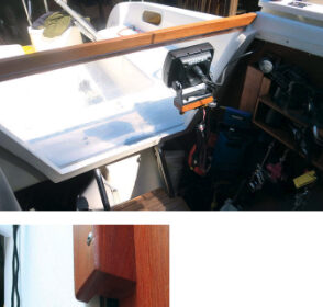 The piece of clear Plexiglas that Henk used for the hatchboard was short by two inches, at top, but that proved to be a good thing as the gap allows for ventilation but, most of the time, does not admit rain. For those occasions when the wind and rain are from aft, a teak strip closes the gap, above. After expanding the storage space a little, Henk is able to stow the Plexiglas board alongside the normal hatchboard, at left.
