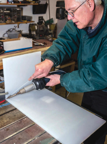 For long welds. Homer used the speed-welding tip. The rip fence on the table saw worked well as a jig to hold the material, but that did not prevent it from warping.