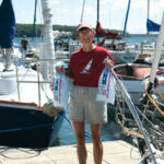 Women holding bags of ice