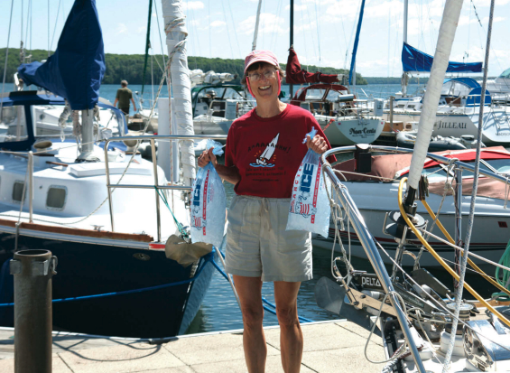 Women holding bags of ice
