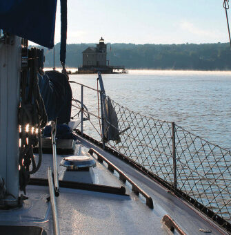 A lighthouse marks the confluence where Rondout Creek joins the Hudson River and tidal and river currents play tag.