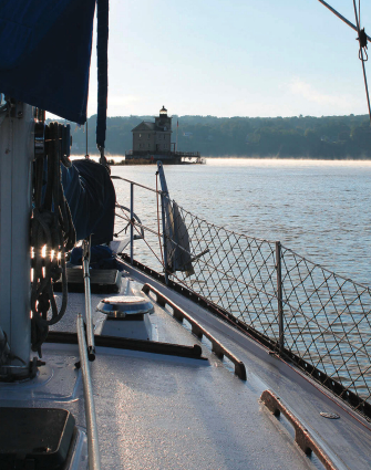 A lighthouse marks the confluence where Rondout Creek joins the Hudson River and tidal and river currents play tag.