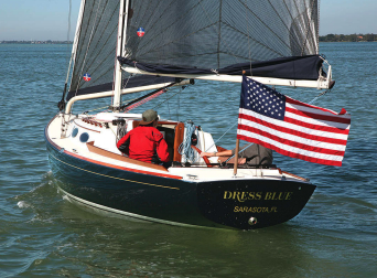 Dress Blue sailing in her suit of black sails is a common sight on Sarasota Bay. Stephen is often accompanied by his young friend Patrick Hibbs, another accomplished sailor.
