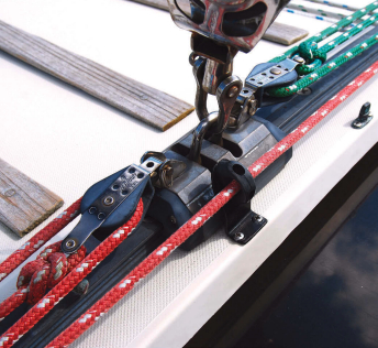 A small bulls-eye fairlead solved the problem of the port-side control line’s tendency to chafe on the sea hood.