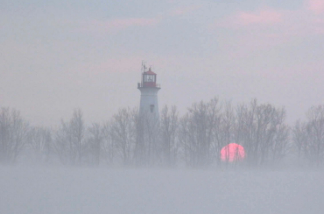 As the fog rolled in, Matt and Penny were happy to see the lighthouse on the end of Long Point, Ontario, their anchorage for the night.