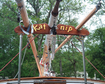 Boom gallows, decorated with the boat’s name, are traditional and practical, as they stop the heavy boom from dropping into the cockpit.
