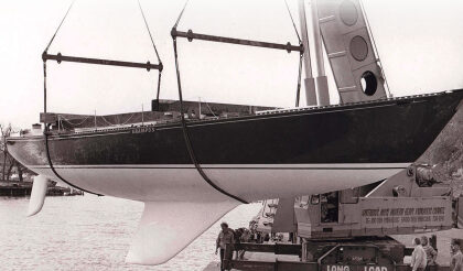 The moderately swept second generation of the C&C fin keel can be seen here on the C&C 61, Grampus, at her launching in Bronte, Ontario, in the mid-1970s, at top. Her builder, Erich Bruckmann, wearing a white windbreaker, is standing by the crane. C&C Yachts featured the distinctive hull profile with its highly swept keel in its sales literature, at left, which made it a little awkward to easily abandon this approach to keel design even after more effective shapes were developed.