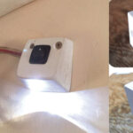 liff’s small light, aimed at the object of interest in the head, sheds enough light for its purpose without impairing his night vision, main photo. To make his LED lamp, Cliff glued two pieces of plastic together. The big hole on the back, upper above, houses the wiring; the small hole is for the LED. Another view of the base shows the hole on the top for the switch, above. The cross-hatched area is to be cut off. Cliff says it’s best to do that after drilling the holes.