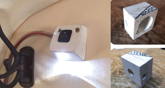 liff’s small light, aimed at the object of interest in the head, sheds enough light for its purpose without impairing his night vision, main photo. To make his LED lamp, Cliff glued two pieces of plastic together. The big hole on the back, upper above, houses the wiring; the small hole is for the LED. Another view of the base shows the hole on the top for the switch, above. The cross-hatched area is to be cut off. Cliff says it’s best to do that after drilling the holes.