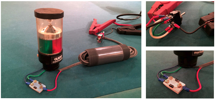 John made this model of his two-wires-into-three trick for demonstration purposes — he happened to have the Guest combination light lying around. The PVC tube represents the mast with the wires running through it, above left. One wire leads from the switch to the diodes, the other to the common return in the fixture. For this demo, John used colored wires for clarity, not to meet any code. The power supply is connected to the center tabs on the DPDT switch, upper right. The end tabs are cross connected so the polarity is opposite in the two “on” positions. Again, the wire colors are for clarity. The gray ends of the diodes point in opposite directions. The polarity of the wire at the common connection determines through which circuit electricity will flow. (The diodes could be arranged to fit inside some light fixtures.)