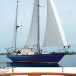 Even in her least favorite conditions, light air, Mug Up strikes an eye-catching stance in Gloucester Harbor, above. Give her some heavy air and sea room, Mark says, and she’s off like a thoroughbred. The name is appropriate to the hailing port, at right. “Mug up” was the Gloucester fishermen’s break for coffee — perhaps with a dollop of rum on cold days.