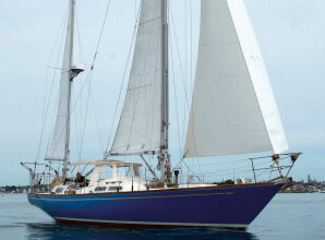 Even in her least favorite conditions, light air, Mug Up strikes an eye-catching stance in Gloucester Harbor, above. Give her some heavy air and sea room, Mark says, and she’s off like a thoroughbred. The name is appropriate to the hailing port, at right. “Mug up” was the Gloucester fishermen’s break for coffee — perhaps with a dollop of rum on cold days.