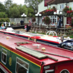 Canal-side pubs are an almost irresistible attraction for narrowboat, at top.
