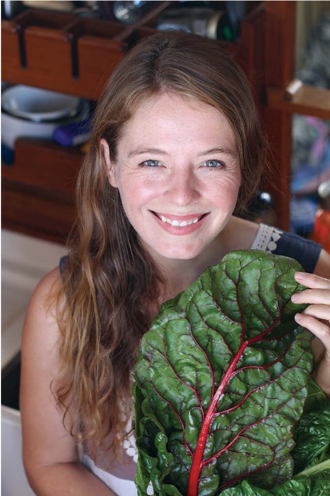 woman holding a vegetable