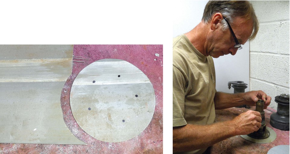 Drew cut the material for his backing plates out of a fiberglass bulkhead from a boat that was being sliced up for the dumpster, left. Holding a Sharpie vertically, Drew made circles on the backing plate inside the holes in the winch base, right. He drills 1⁄32 inch oversize to allow for alignment and measuring errors.
