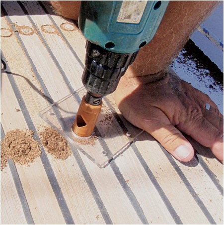 man drilling boat decking