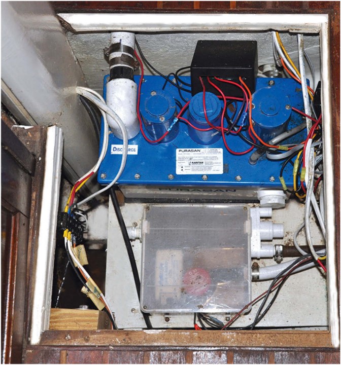 Roger installed the Purasan waste-treatment system low in the bilge where it’s out of sight but accessible.