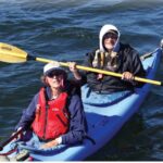 man and woman in kayak