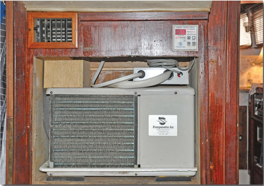 Roger removed two drawers to make a space to fit the second AC unit into the aft cabin. The plywood ducting feeds air to the aft cabin and head, the galley, and the saloon.