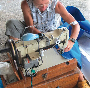 For inspecting and repairing sails, a clean, dry work area and a sewing machine (or a friend with one) make all the difference.
