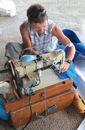 For inspecting and repairing sails, a clean, dry work area and a sewing machine (or a friend with one) make all the difference.