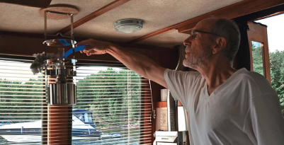 One of Dean’s morning rituals is removing the spiderwebs that festoon the boat inside and out, above. Dean pinched his Swiffer Duster from Charlotte, his wife. The design has since changed but he manages to force the new refills onto his old handle.