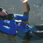 Drew Frye Reading a book in the water
