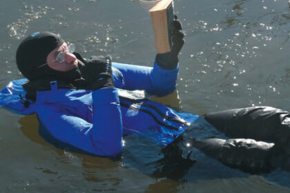 Drew Frye Reading a book in the water