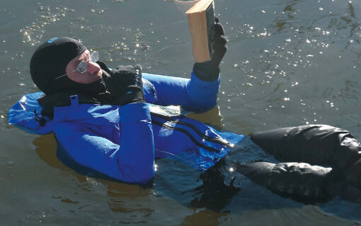 Drew Frye Reading a book in the water