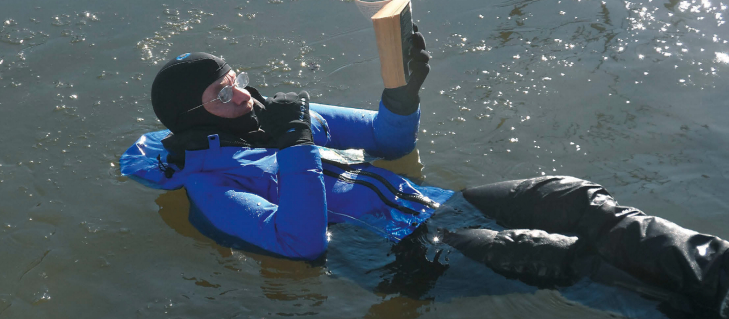 Drew Frye Reading a book in the water
