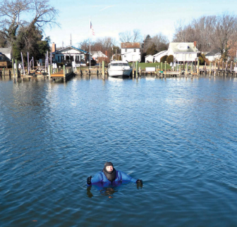 Determined to test his dry suit’s insulation properties thoroughly, Drew spent 2 hours swimming and floating in ice-skimmed water, main photo. Isaac Asimov helped the time go by. The dry suit held Drew’s shoulders nearly clear of the water but would not right him from a facedown position without the help of a life jacket.