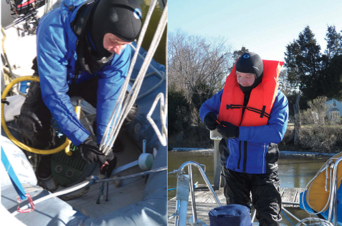 Immersion suits must meet a minimum standard for manual dexterity. The gloves Drew wears with his dry suit impair him very little. Here he is working carabiners on his dinghy davits, at left, and he also had to inflate the dinghy before launching it. While wearing his Neoprene gloves, Drew was able to don a life jacket for his testing and manipulate the plastic catches that secure the straps, below.